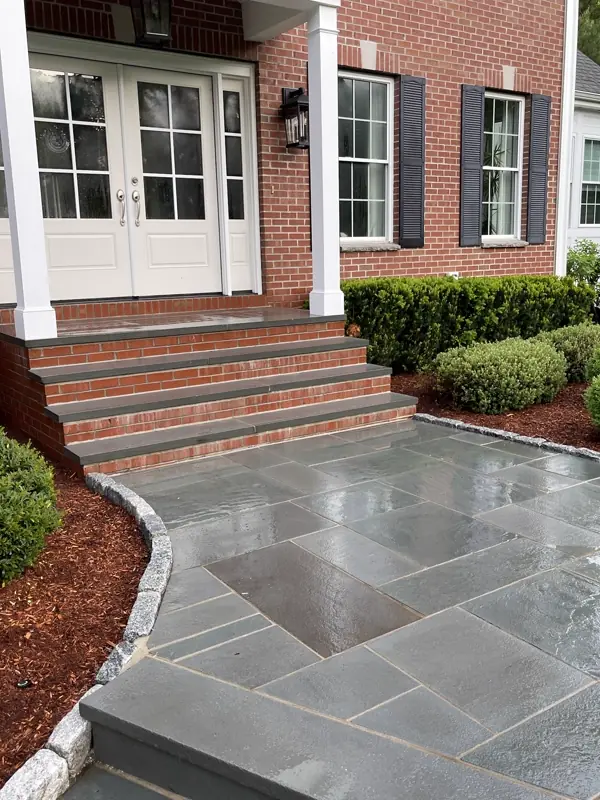 Freshly cleaned brick steps and bluestone walkway