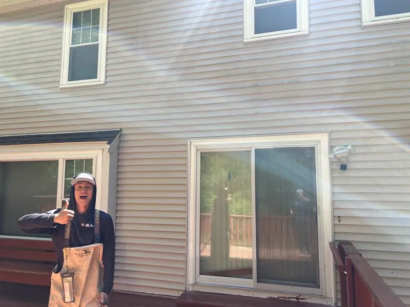 Callahan crew member on a finished house washing job