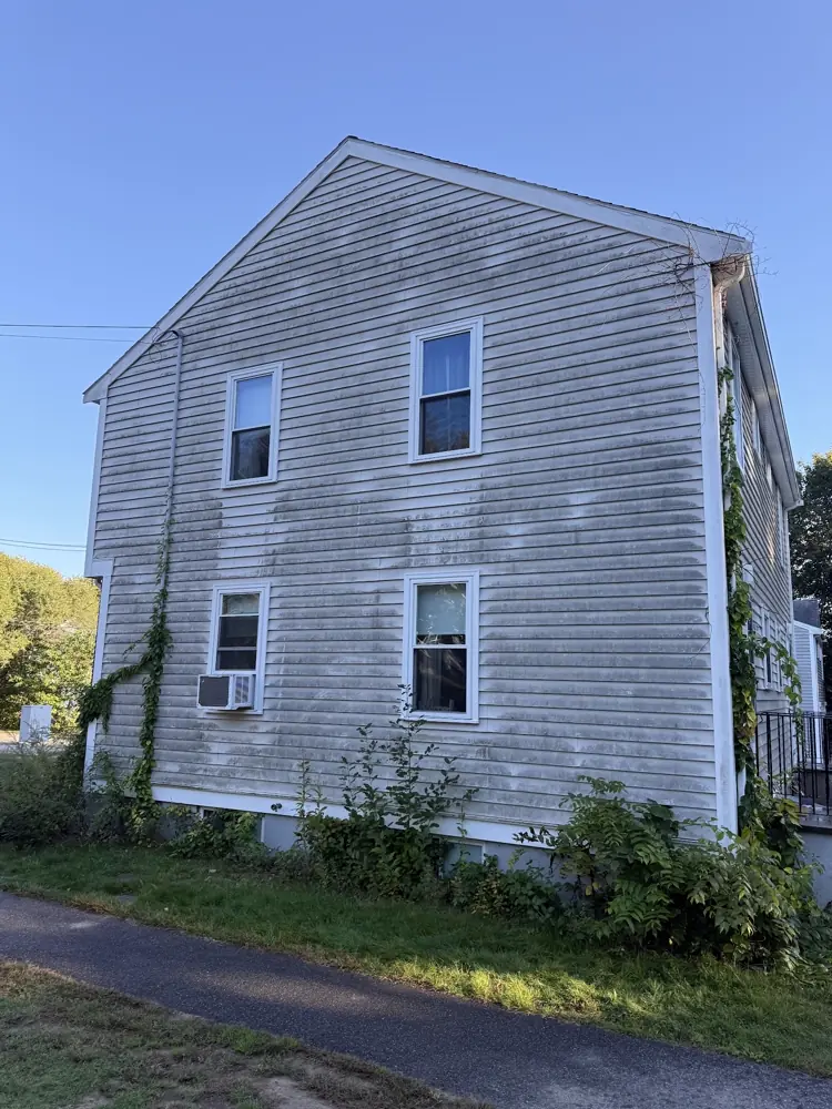 House siding before washing, gray with mildew