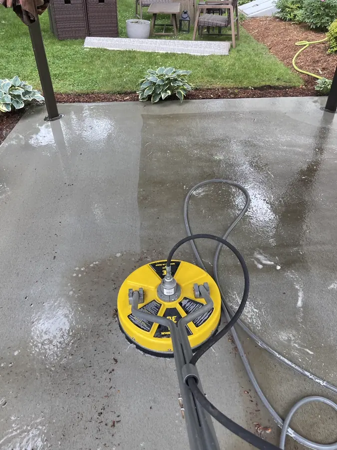 Surface cleaner restoring a concrete patio