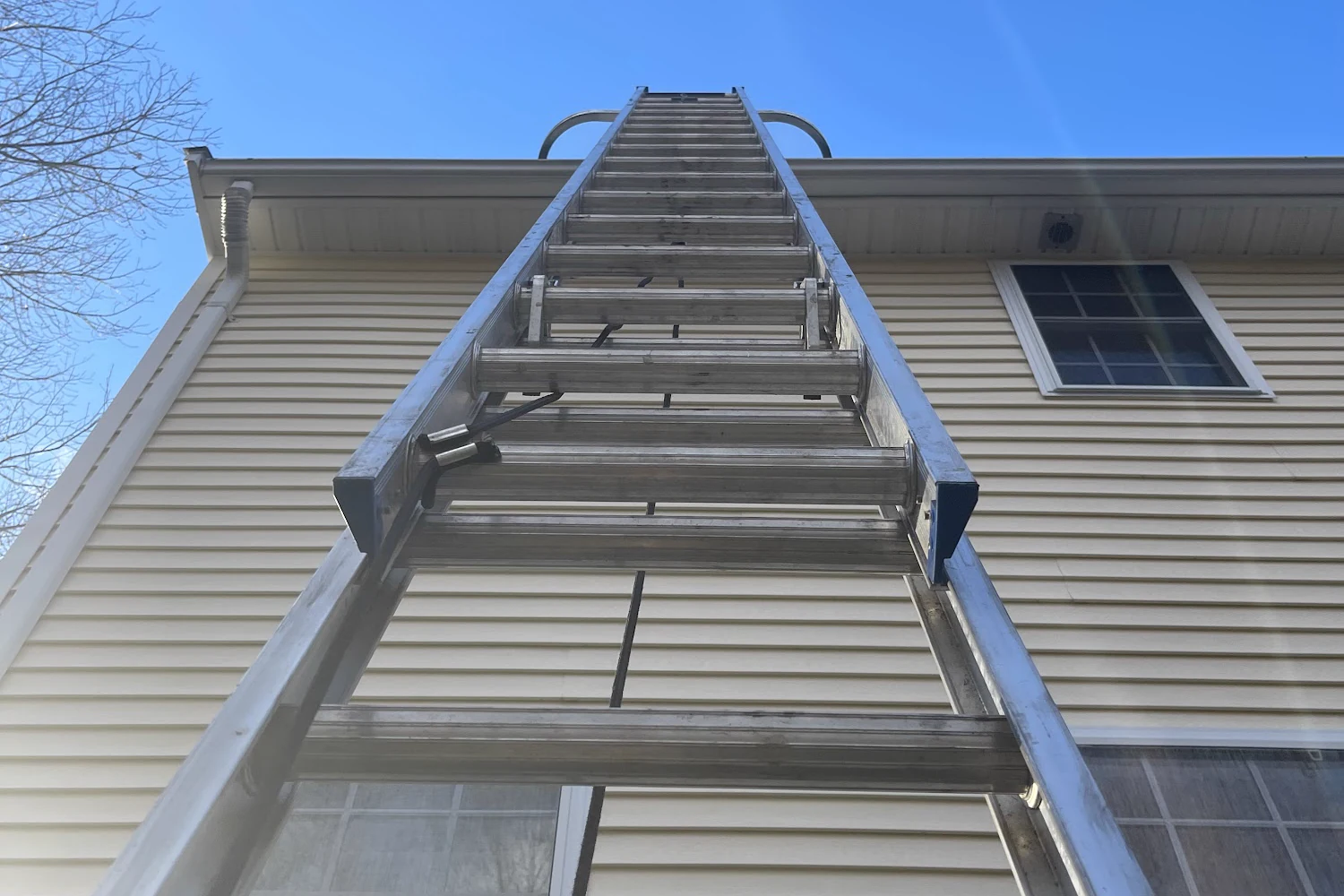 Callahan Exterior Cleaning ladder work at the gutter and roof line